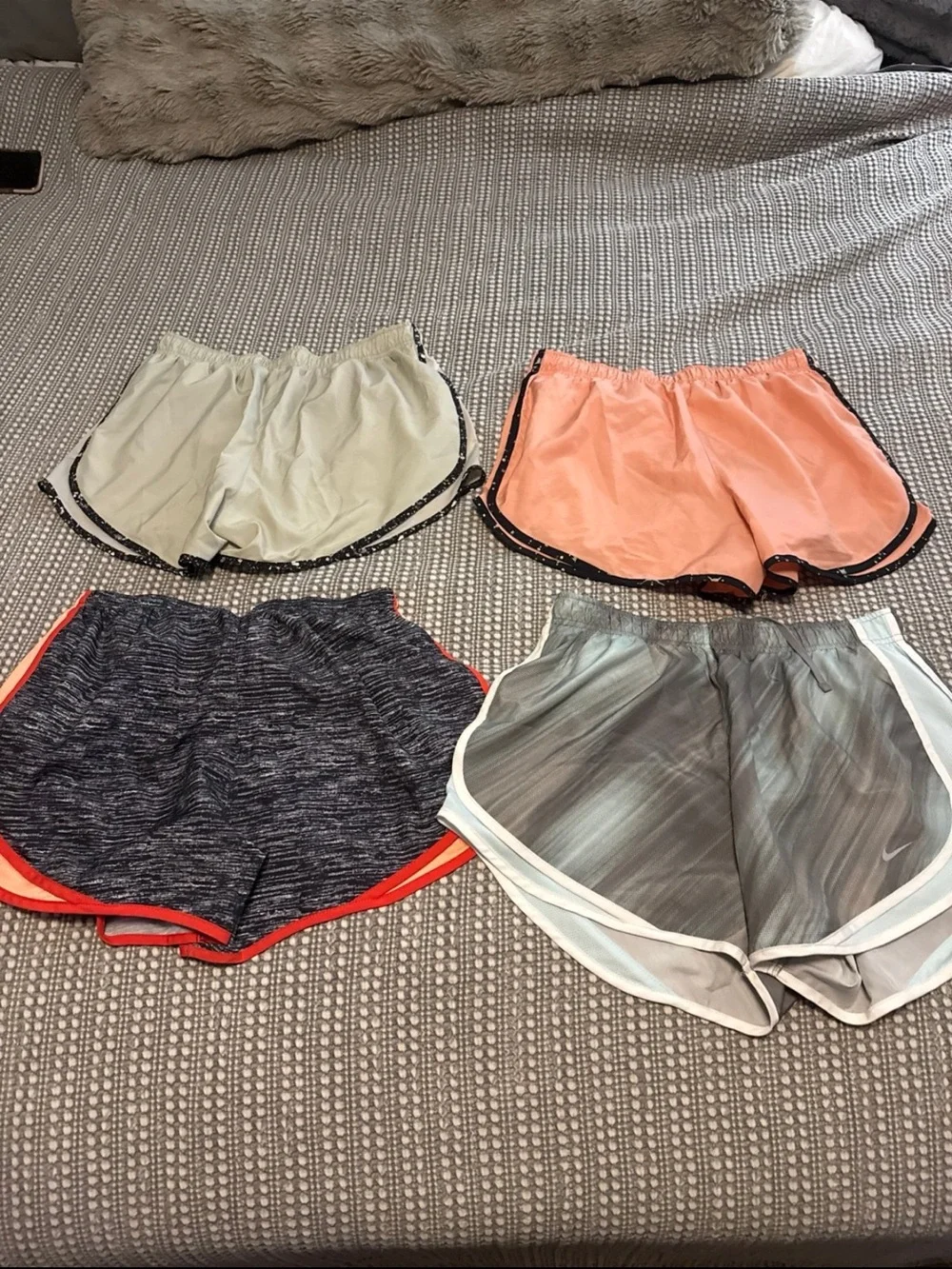 Bundle of 4 Nike women’s running shorts size Large LIKE NEW